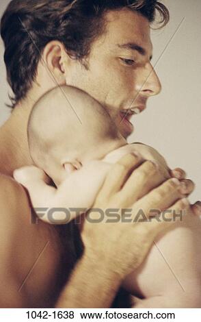 people, baby, calm, holding, family, comforting, father View Large Photo Image Stock Photo - people, baby, calm, holding, family, comforting, father. Fotosearch