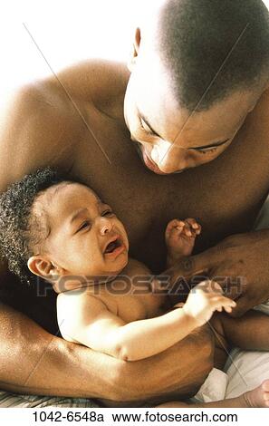 people, baby, crying, holding, family, comforting, father View Large Photo Image Stock Image - people, baby, crying, holding, family, comforting, father. Fotosearch