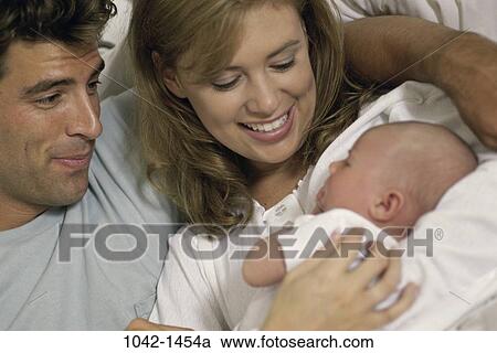 people, baby, holding, nurturing, family, love View Large Photo Image Stock Image - people, baby, holding, nurturing, family, love. Fotosearch