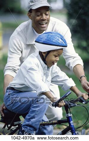 people, balance, hat, bicycle, helmet, outdoors, bike View Large Photo Image Stock Image - people, balance, hat, bicycle, helmet, outdoors, bike. Fotosearch