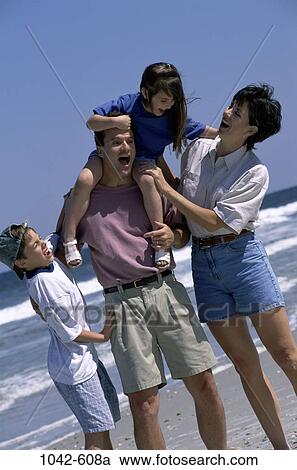 people, beach, challenges, adventurous, carrying, family, Caucasian View Large Photo Image Stock Image - people, beach, challenges, adventurous, carrying, family, Caucasian. Fotosearch