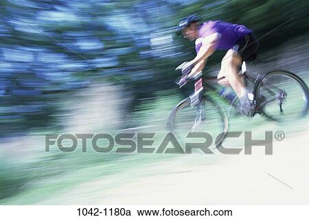 people, blur, bicycle, helmet, riding, motion View Large Photo Image Stock Image - people, blur, bicycle, helmet, riding, motion. Fotosearch