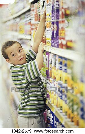 people, blur, boy, shopping, child, store, reaching View Large Photo Image Stock Photo - people, blur, boy, shopping, child, store, reaching. Fotosearch