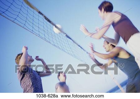 Stock Image - people, blur, playing, beach, sports, competition. Fotosearch