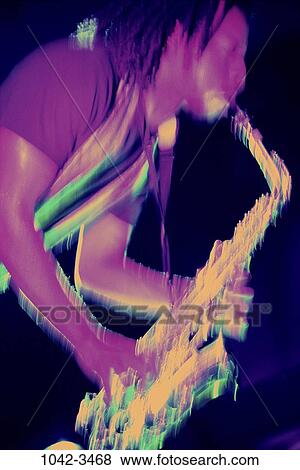 Stock Photo - people, blur, playing, intense, music, motion. Fotosearch