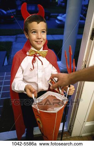 people, candy, boy, costume, outdoors, tradition, bag View Large Photo Image Stock Image - people, candy, boy, costume, outdoors, tradition, bag. Fotosearch
