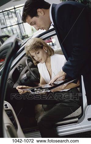 people, car, reading, shopping, salesman, automotive View Large Photo Image Stock Image - people, car, reading, shopping, salesman, automotive. Fotosearch
