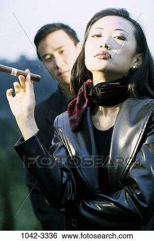 people, cigar, Asian, couple, leather, health, outdoors View Large Photo Image Stock Photograph - people, cigar, Asian, couple, leather, health, outdoors. Fotosearch