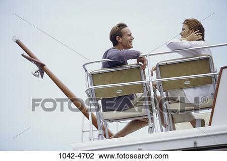 people, conversation, boating, outdoors, sports, boat View Large Photo Image Stock Image - people, conversation, boating, outdoors, sports, boat. Fotosearch