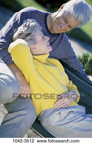 people, couple, bench, sitting, senior, outdoors, park View Large Photo Image Stock Image - people, couple, bench, sitting, senior, outdoors, park. Fotosearch