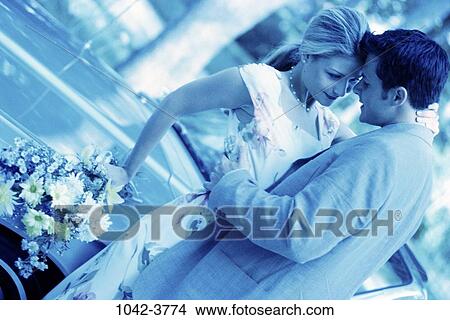 people, couple, blue, car, flowers, outdoors, romantic View Large Photo Image Picture - people, couple, blue, car, flowers, outdoors, romantic. Fotosearch