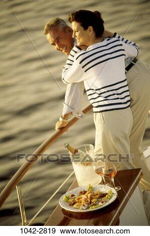 Stock Photo - people, couple, boating, lifestyles, outdoors, boats, transportation. Fotosearch