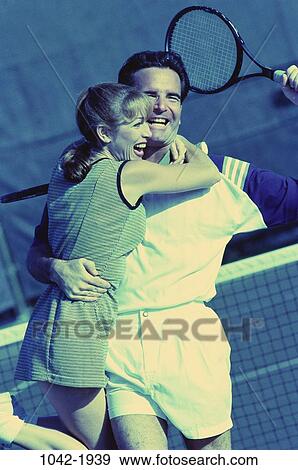people, couple, excitement, excited, happy, tennis, outdoors View Large Photo Image Stock Photo - people, couple, excitement, excited, happy, tennis, outdoors. Fotosearch