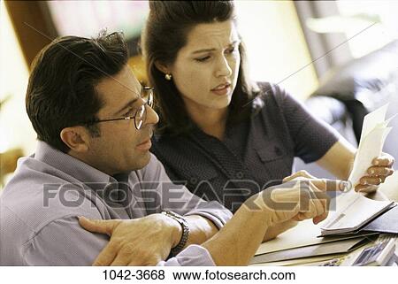 people, couple, eyeglasses, pointing, point, Middle-aged View Large Photo Image Stock Photo - people, couple, eyeglasses, pointing, point, Middle-aged. Fotosearch