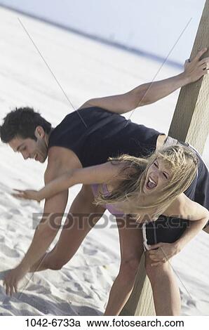 people, couple, happy, beach, playful, indulgence View Large Photo Image Stock Image - people, couple, happy, beach, playful, indulgence. Fotosearch