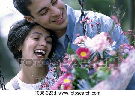 people, couple, Hispanic, flowers, outdoors, joyous, romance View Large Photo Image Stock Image - people, couple, Hispanic, flowers, outdoors, joyous, romance. Fotosearch