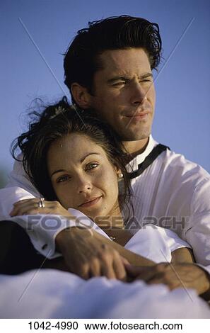 people, couple, holding, outdoors, hugging, relaxing, resting View Large Photo Image Stock Image - people, couple, holding, outdoors, hugging, relaxing, resting. Fotosearch