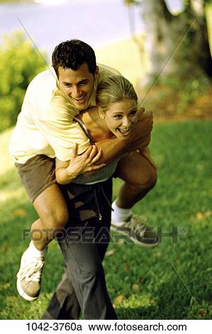 people, couple, laughing, outdoors, adventurous, carrying, joyous View Large Photo Image Stock Image - people, couple, laughing, outdoors, adventurous, carrying, joyous. Fotosearch