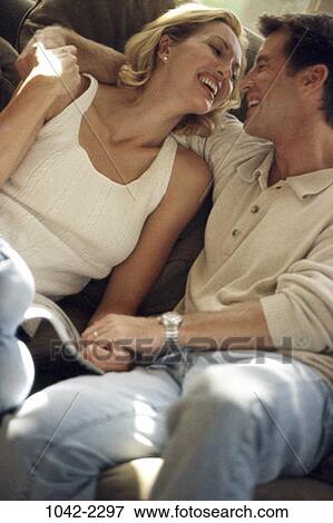 Stock Photo - people, couple, lifestyles, Middle-aged, affection, romance, holding hands. Fotosearch