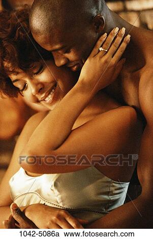 Stock Image - people, couple, romantic, passion, hugging, embracing, affection. Fotosearch