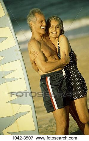 people, couple, senior, beach, laughing, hugging, embracing View Large Photo Image Stock Photo - people, couple, senior, beach, laughing, hugging, embracing. Fotosearch