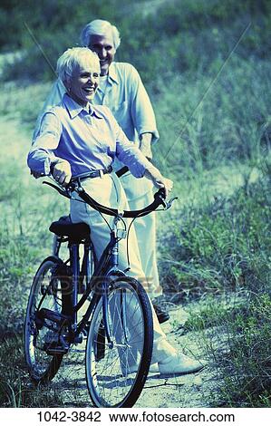 people, couple, senior, bicycle, riding, outdoors, exercise View Large Photo Image Stock Image - people, couple, senior, bicycle, riding, outdoors, exercise. Fotosearch