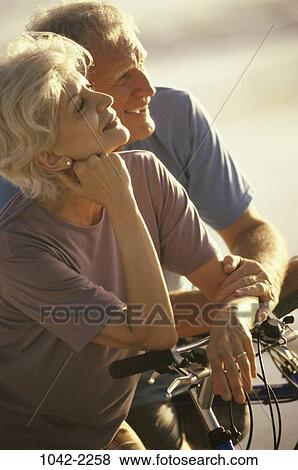 people, couple, senior, bicycle, laughing, outdoors, relaxing View Large Photo Image Stock Photo - people, couple, senior, bicycle, laughing, outdoors, relaxing. Fotosearch