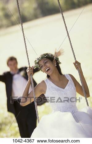 people, couple, sitting, laughing, swinging, swing, motion View Large Photo Image Stock Photo - people, couple, sitting, laughing, swinging, swing, motion. Fotosearch
