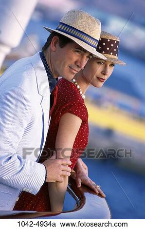 people, couple, stylish, ship, hats, standing, outdoors View Large Photo Image Stock Image - people, couple, stylish, ship, hats, standing, outdoors. Fotosearch