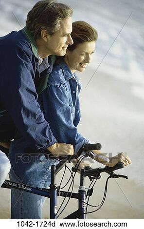 people, couple, watch, outdoors, sports, Middle-aged, watching View Large Photo Image Stock Image - people, couple, watch, outdoors, sports, Middle-aged, watching. Fotosearch