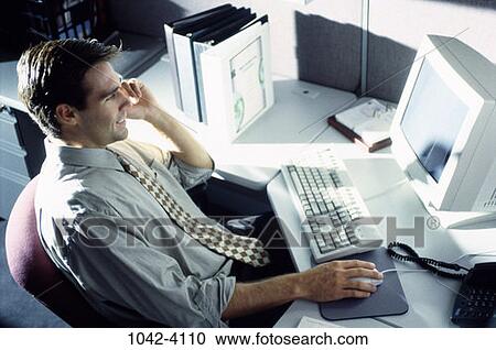 Stock Image - people, desk, computer, work, working, office. Fotosearch