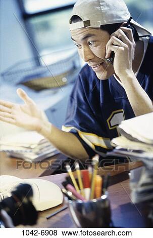 people, desk, home, telephone, Hispanic, phone View Large Photo Image Stock Photo - people, desk, home, telephone, Hispanic, phone. Fotosearch