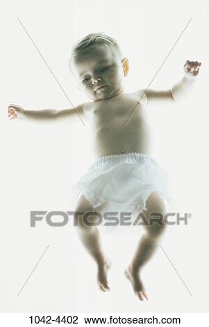 Stock Image - people, diaper, floating, baby, grainy, innocence, brunette. Fotosearch