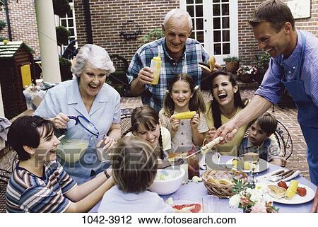 Stock Image - people, eating, drinking, laughing, three, outdoors. Fotosearch