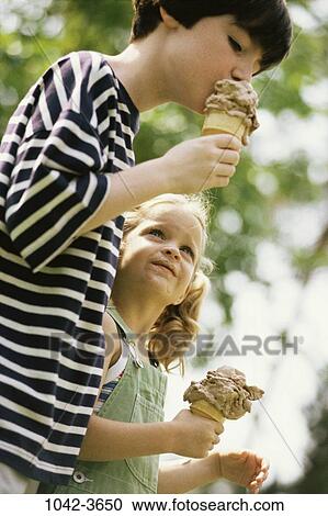 people, eating, ice cream, watch, outdoors, looking, watching View Large Photo Image Stock Image - people, eating, ice cream, watch, outdoors, looking, watching. Fotosearch