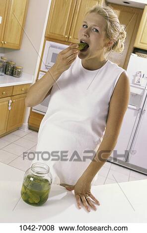 people, eating, woman, blond, kitchen, indulgence View Large Photo Image Stock Photo - people, eating, woman, blond, kitchen, indulgence. Fotosearch