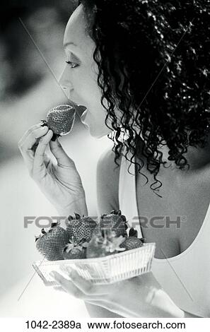 people, eating, woman, profile, fruit, outdoors, sweet View Large Photo Image Stock Image - people, eating, woman, profile, fruit, outdoors, sweet. Fotosearch