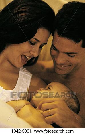 people, excited, Hispanic, holding, family, cuddling, brunette View Large Photo Image Stock Image - people, excited, Hispanic, holding, family, cuddling, brunette. Fotosearch