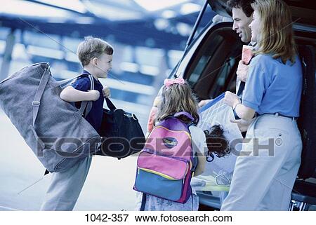 Stock Photo - people, excitement, car, luggage, adventurous, family. Fotosearch