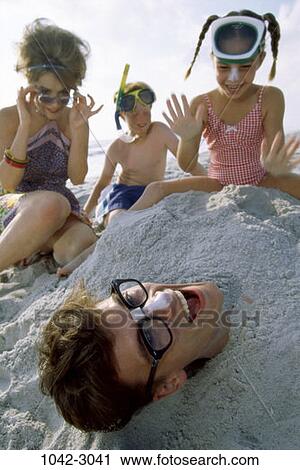 Stock Image - people, eyeglasses, face, tape, beach, mask, family. Fotosearch
