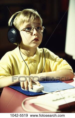 Stock Photo - people, eyeglasses, mouse, computer, boy, education, learning. Fotosearch