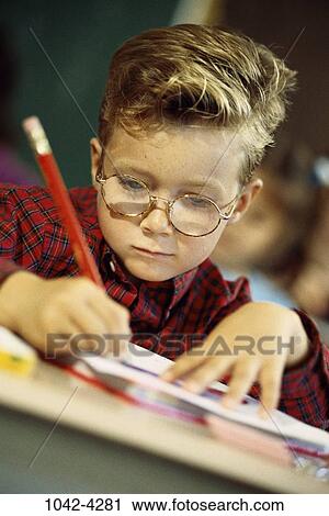 people, eyeglasses, pencil, concentration, school, boy, writing View Large Photo Image Stock Image - people, eyeglasses, pencil, concentration, school, boy, writing. Fotosearch
