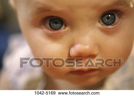 Stock Photo - people, eyes, baby, crying, curious, sad. Fotosearch