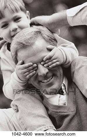 Stock Image - people, eyes, playing, covering, playful, outdoors, carrying. Fotosearch