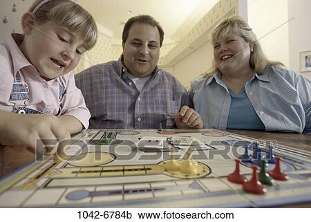 Stock Image - people, family, parents, indoors, Families indoors various. Fotosearch