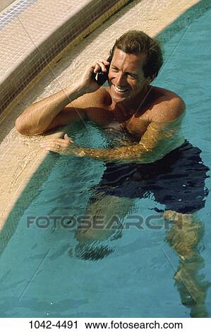 people, floating, pool, smiling, telephone, talking View Large Photo Image Stock Image - people, floating, pool, smiling, telephone, talking. Fotosearch