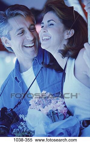 people, flowers, outdoors, Middle-aged, camera, bouquet, romance View Large Photo Image Stock Photography - people, flowers, outdoors, Middle-aged, camera, bouquet, romance. Fotosearch