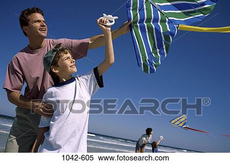 people, flying, beach, lifestyles, challenges, achievement, pairs View Large Photo Image Stock Photography - people, flying, beach, lifestyles, challenges, achievement, pairs. Fotosearch