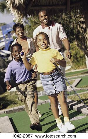 people, golf, outdoors, family, leisure, parents, recreation View Large Photo Image Stock Photo - people, golf, outdoors, family, leisure, parents, recreation. Fotosearch