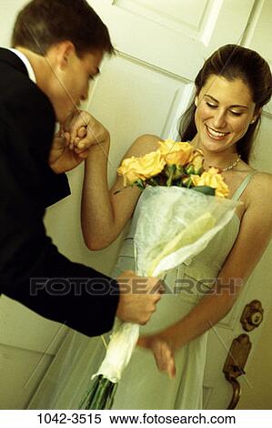 Stock Photography - people, hand, smiling, couple, flowers, romantic, joyous. Fotosearch